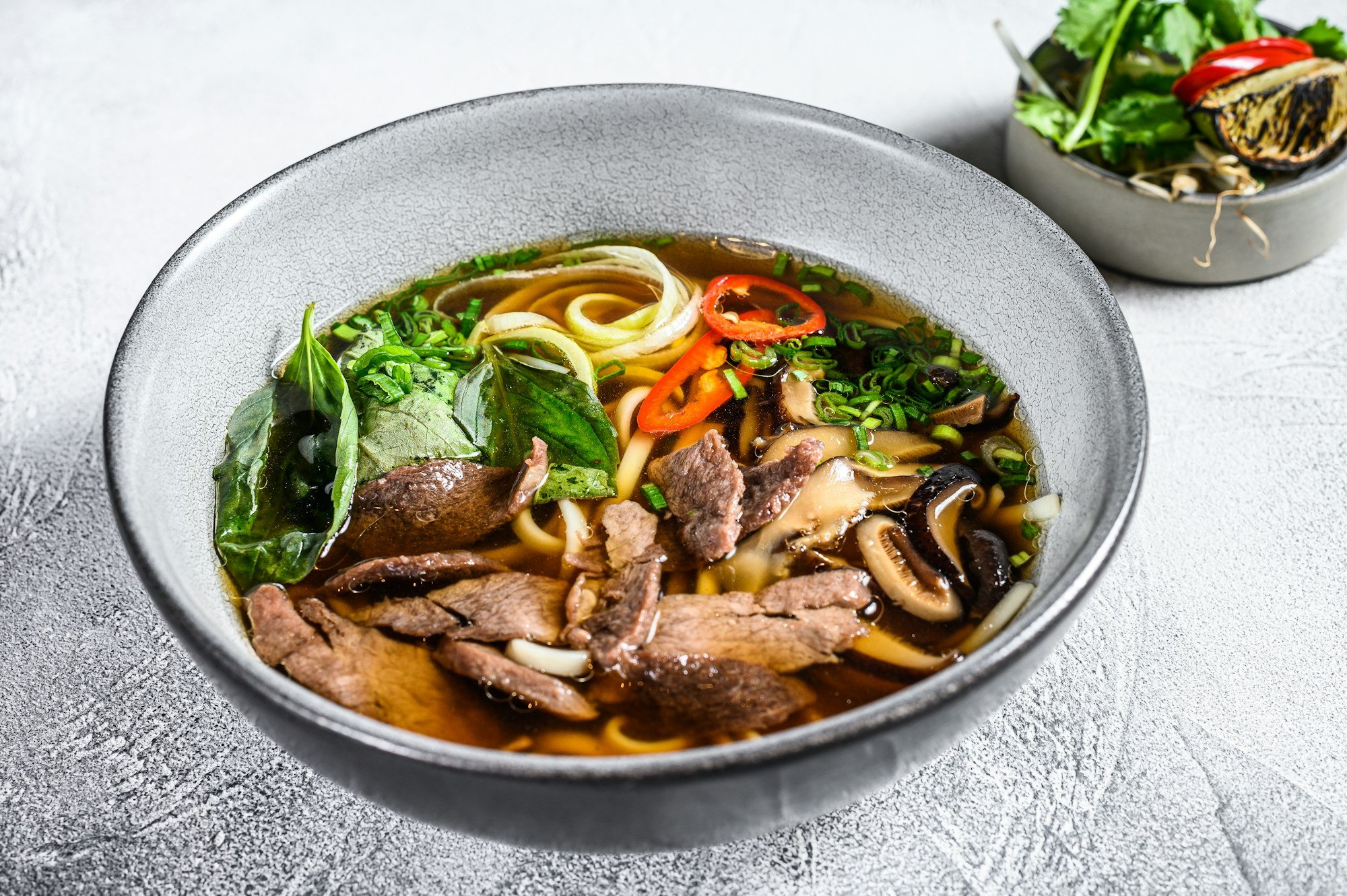 Pho Bo vietnamese Soup with beef. White background. Top view